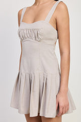 PLEATED MINI DRESS WITH BACK TIES