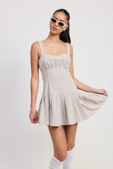 PLEATED MINI DRESS WITH BACK TIES